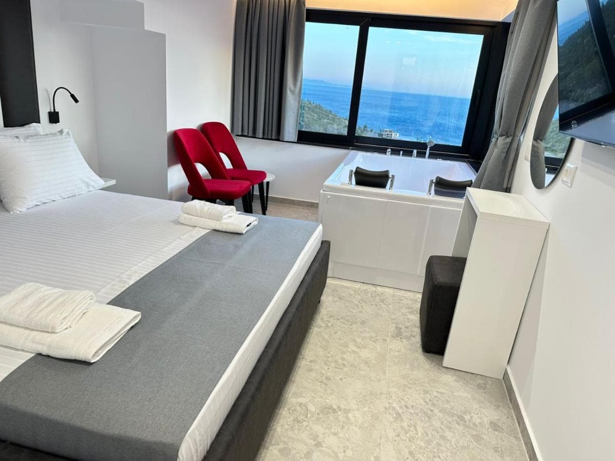 Spa bath beside the bed with open sea view