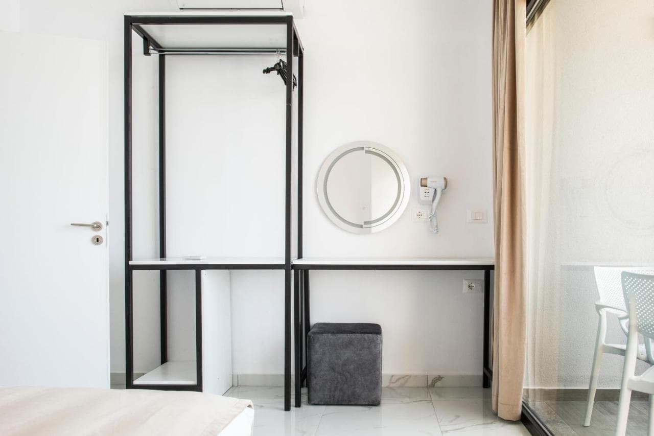 Minimal wardrobe and desk in a deluxe room